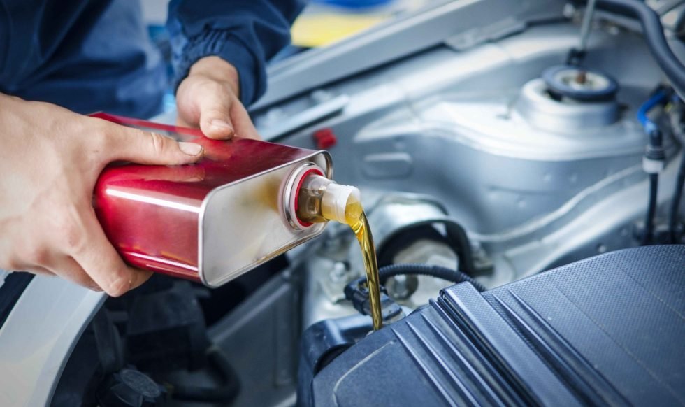 mechanic-changing-engine-oil-car-vehicle (1)